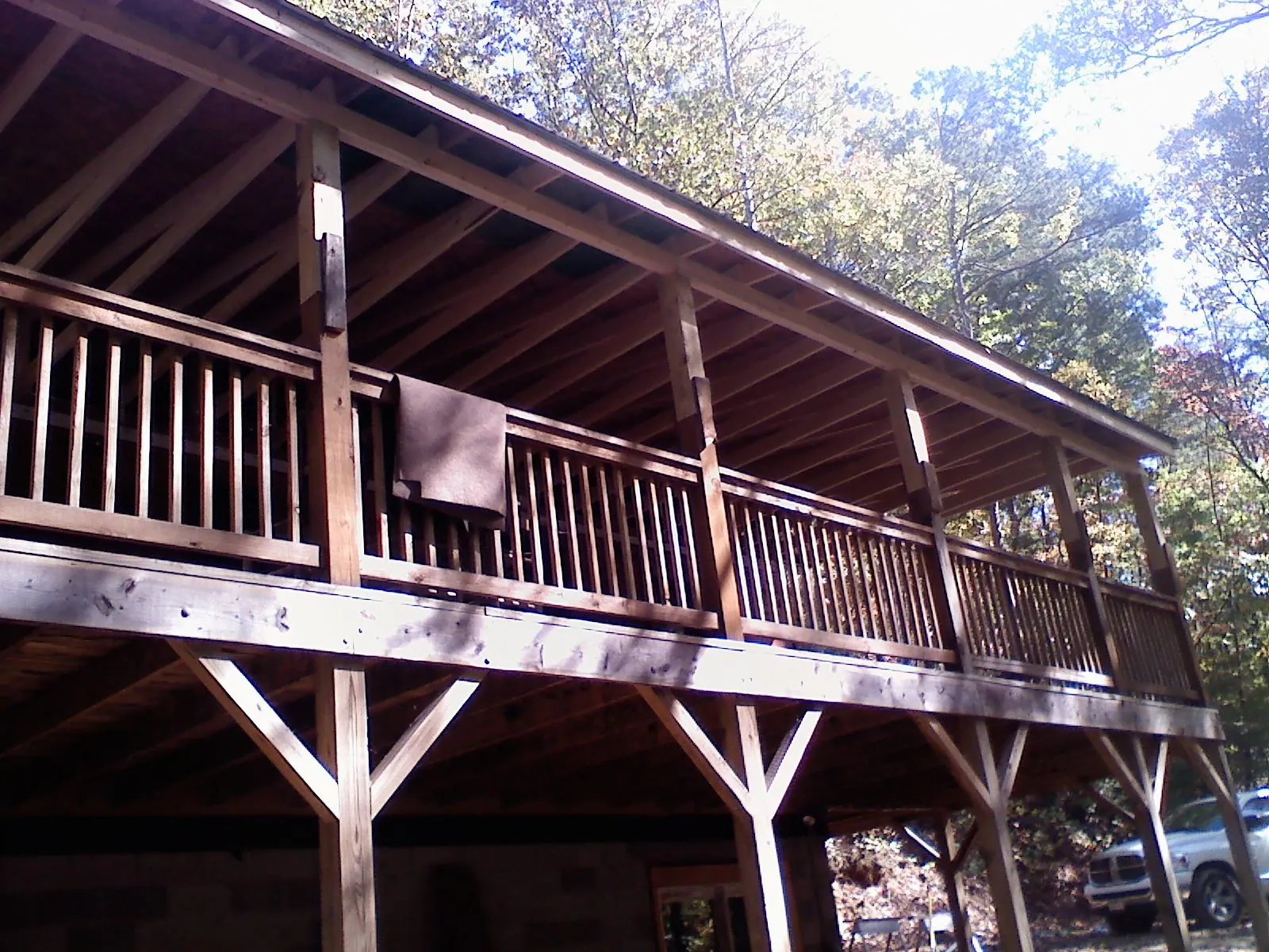 Timber framing under a new elevated porch and deck — Roof Leak Repair in Framingham by Roofing Brothers